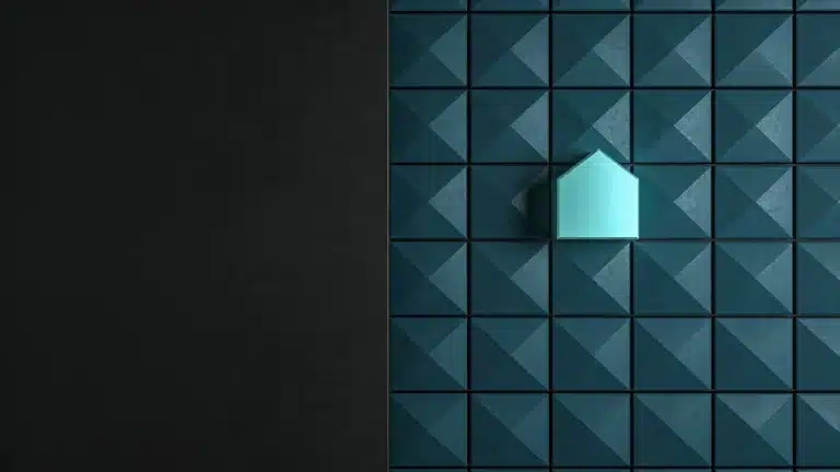 A single illuminated tile standing out from a wall of dark teal tiles